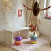 Kilim Play Mat in Soft Clay with girl playing 