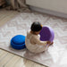 Kilim Play Mat in Soft Clay with a baby playing 