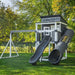 Kingdom Lodge Playhouse with slide and swing in a yard