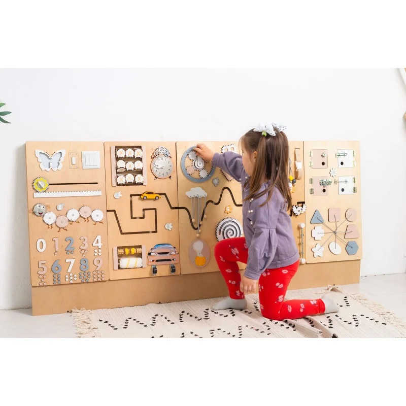 BumbleBeeSmart Sensory Wall Panel with a girl playing 