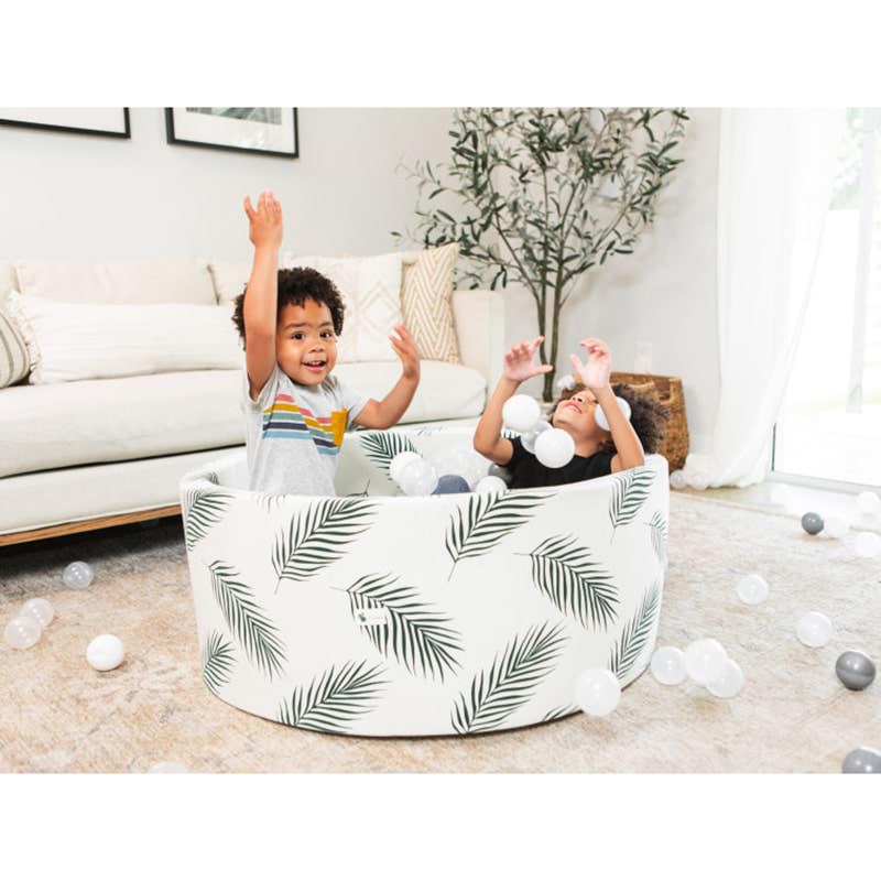 little-big-playroom-ball-pit-boho-palm-ball-pit-100-porcelain-and-100-pearl-balls-2-kids-playing-inside-the-ball-pit-arms-raised