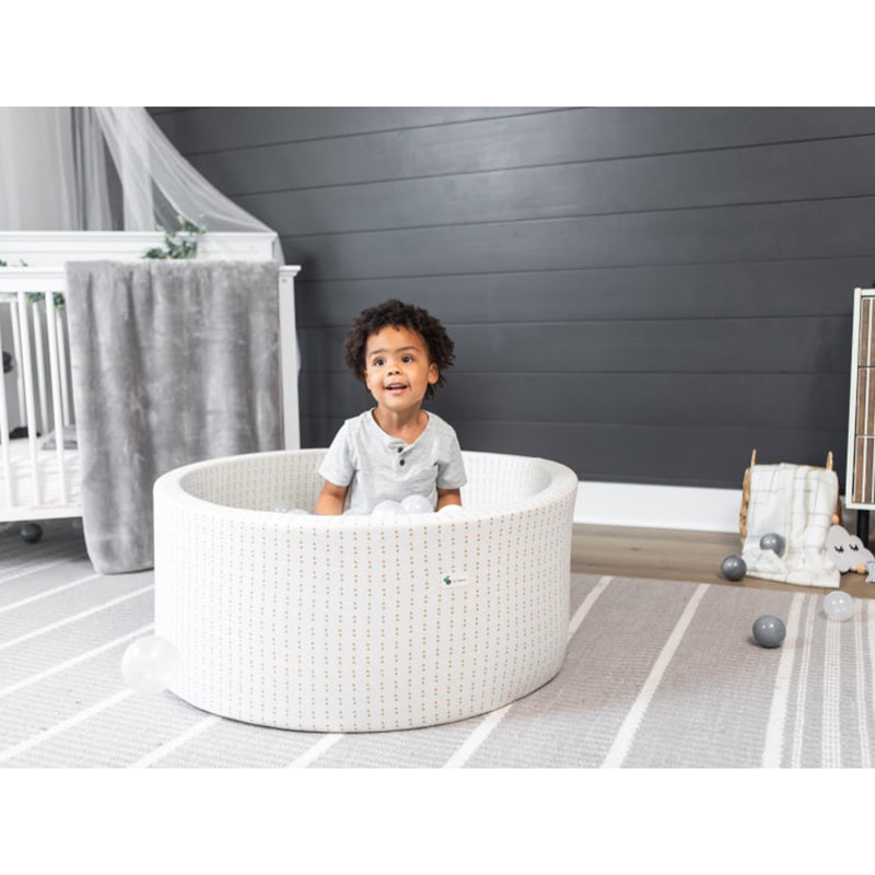 little-big-playroom-ball-pit-boho-triangle-ball-pit-67-water-67-pearl-and-66-stone-balls-front-view-with-kid-playing-inside-the-ball-pit