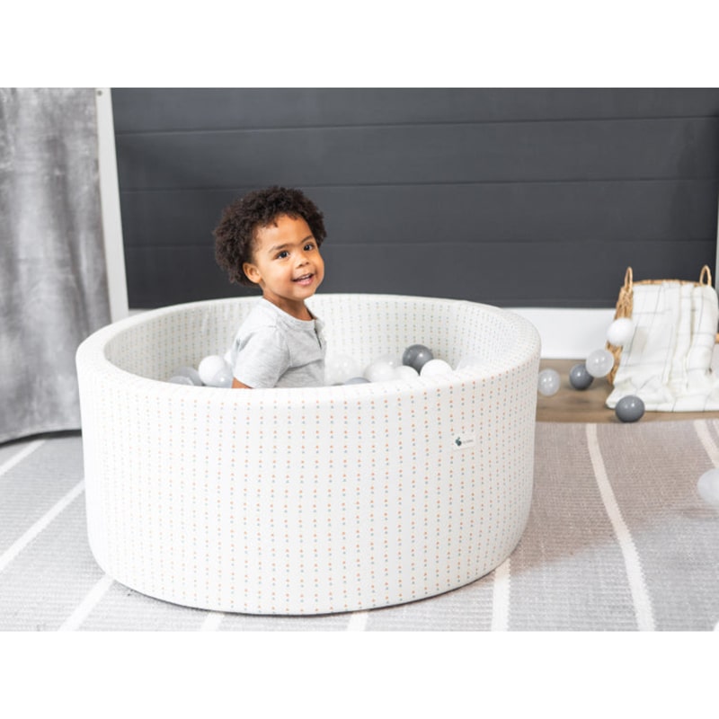 little-big-playroom-ball-pit-boho-triangle-ball-pit-67-water-67-pearl-and-66-stone-balls-kid-playing-inside-the-ball-pit-smiling-and-happy