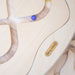 Close-up of the wooden Loomi Wobble Board and maze surface