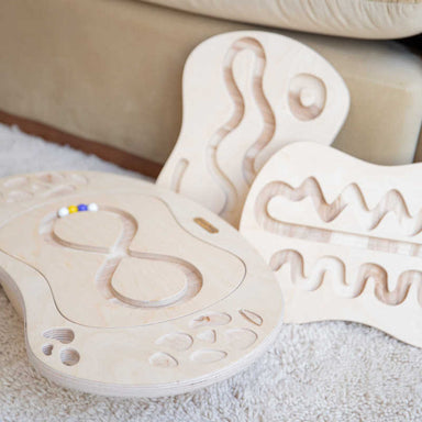 Loomi Wobble Board shown with interchangeable maze inserts