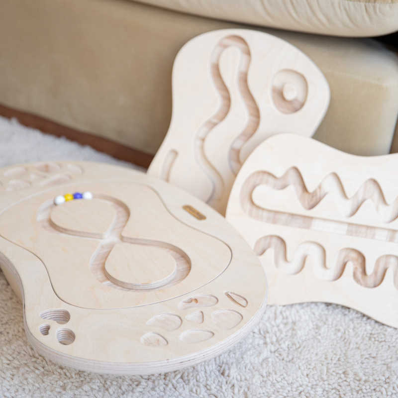 Loomi Wobble Board shown with interchangeable maze inserts