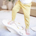 Boy balancing on the Loomi Wobble Board with a maze insert
