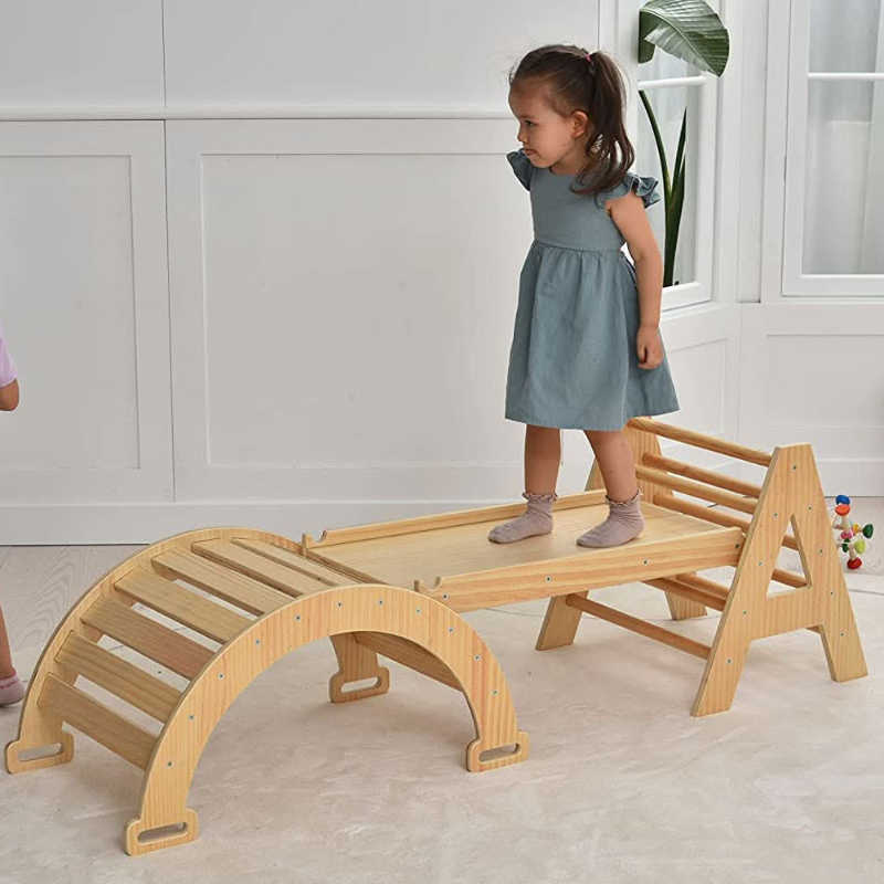 Maple Beginner Pikler Triangle and Rocker with a girl playing