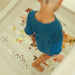 Mini World Map Inside Bounce House top view of floor with boy
