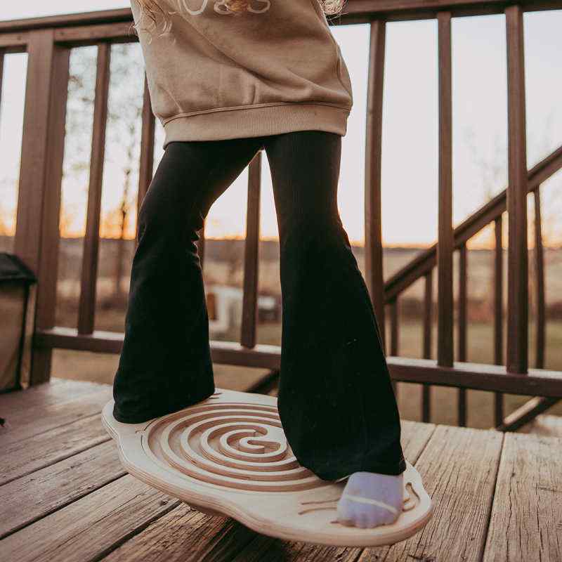 Mira Balance Board with interchangeable maze on an outdoor deck