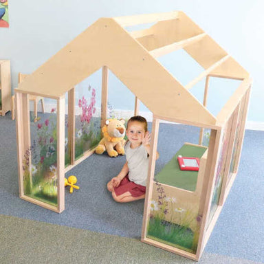 Whitney Brothers Nature View Wooden Play Greenhouse (Wb0511) with kid playing with toys