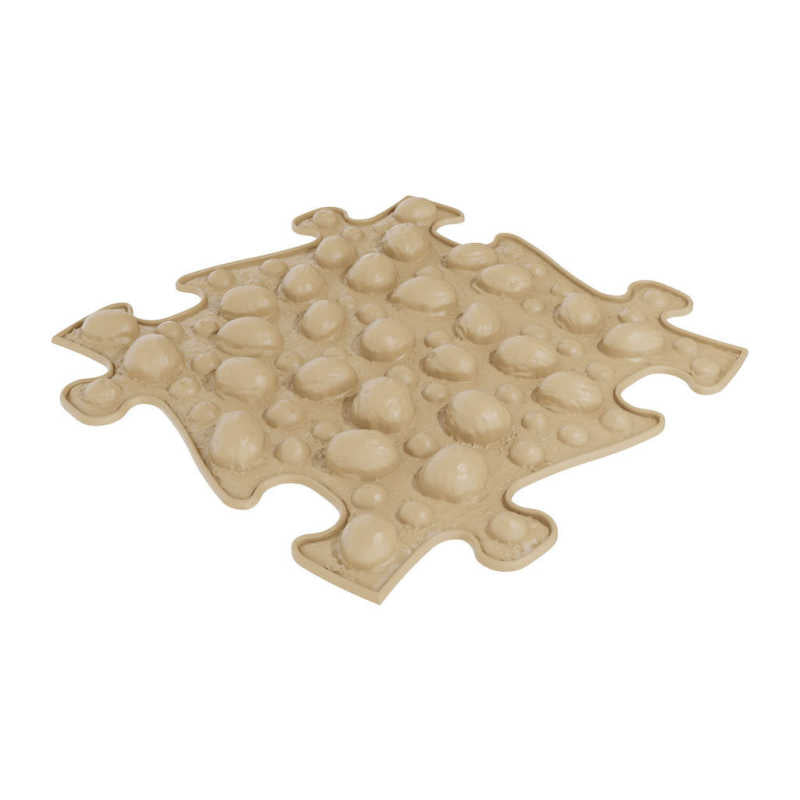 Beige nut pattern on a sensory play mat