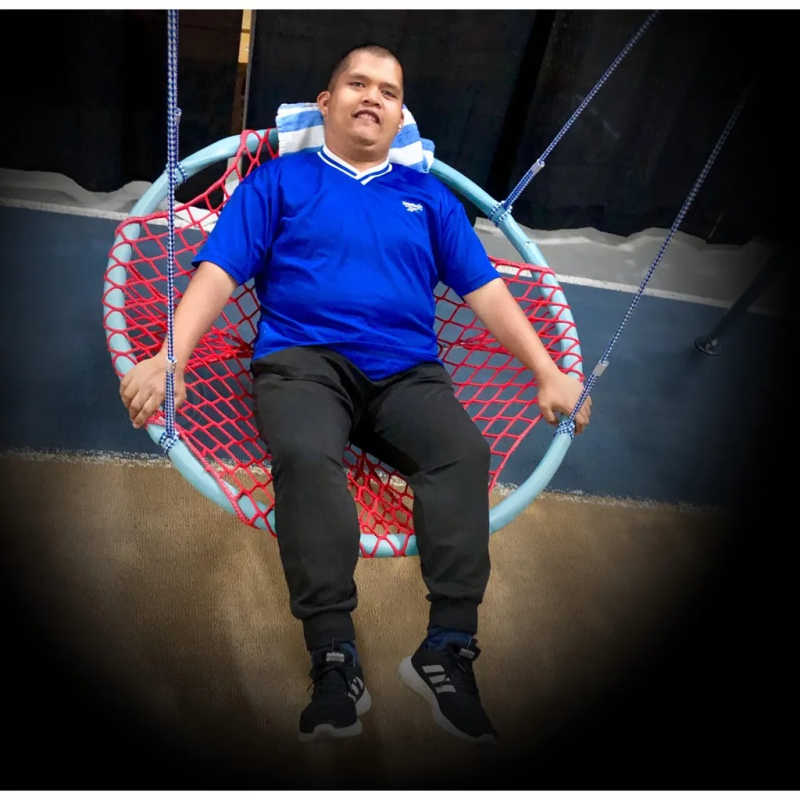 Nest Swing 8BRNS – boy using the sensory nest swing