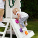 Outdoor water play for toddlers with boy climibing
