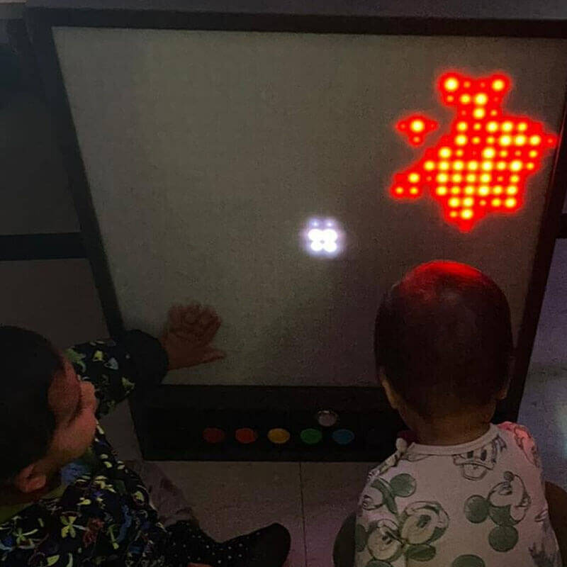 Pixels Pro Interactive Panel Red and White Led Clusters with kids