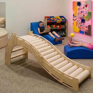 Sensory roller slide rocker combo in a sensory room