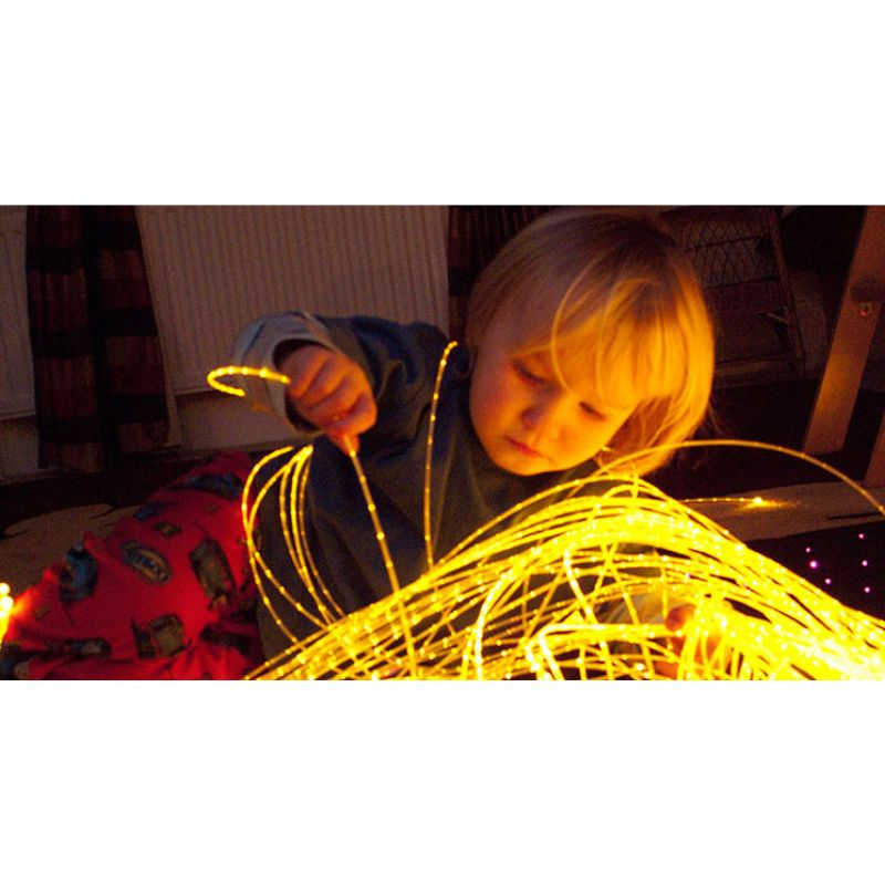 Sidesparkle Fiber Optic Sensory Light Strands with kid playing