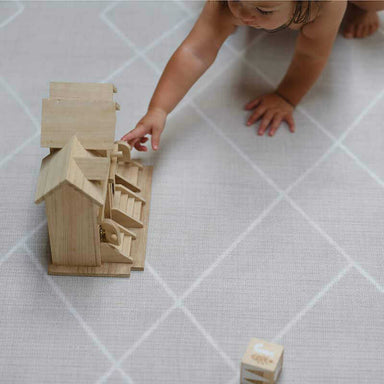 Shwally Odessa Double Sided Play Mat with a baby playing 