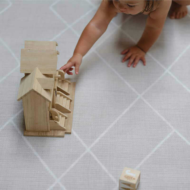 Shwally Odessa Double Sided Play Mat with a baby playing 