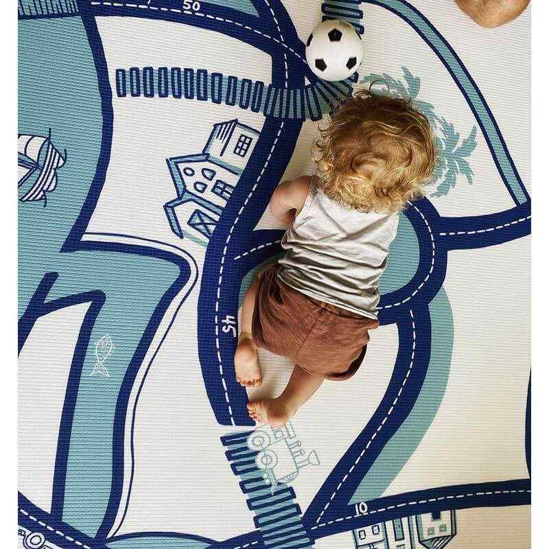 Shwally August Rose White Reversible Playmat on colorful side with  baby crawling