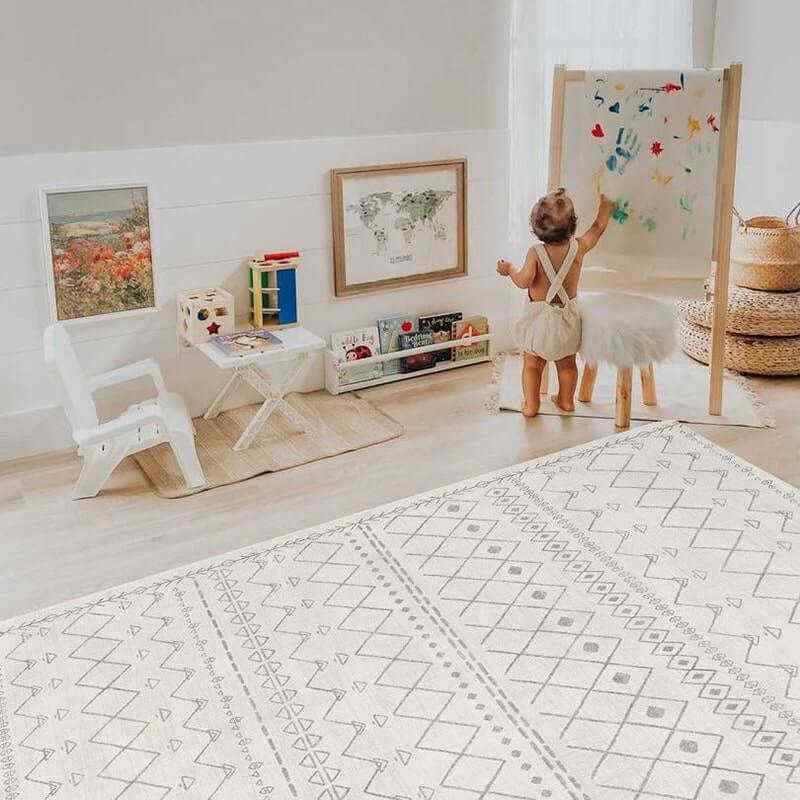 Shwally Enya Double Sided Playmat with a toddler painting on the neutral side