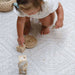 Shwally Remi Reversible Play Mat with a baby playing 