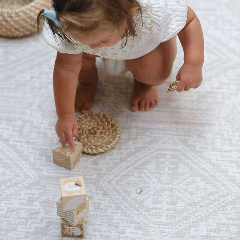 Shwally Remi Reversible Play Mat with a baby playing 