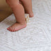 Shwally Remi Play Mat with a baby standing on it