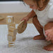 Shwally Remi Play Mat with a baby playing on it with blocks