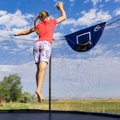 Skywalker trampoline basketball hoop accessory with Girl dunking a basketball