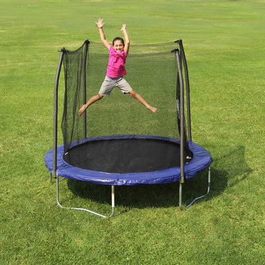 Skywalker Trampolines 8' Round Trampoline with a girl jumping 
