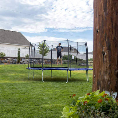 Skywalker Trampolines Blue 14' Square Trampoline Showing A Kid Jumping Outdoor