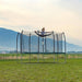 Skywalker Trampolines Green 14' x 8' Rectangle Trampoline Front View Showing A Girl Splitting On The Air Outdoor