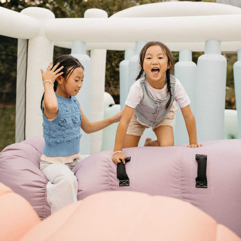 Smol Course Bounce House with girls climbing 