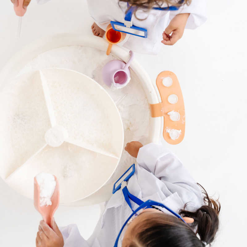 Top view of the Smol Curiosity Water Table with test tubes, beakers, and water play features