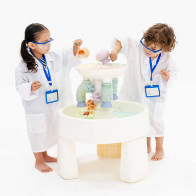 Two kids exploring STEM water play with the Smol Curiosity Water Table