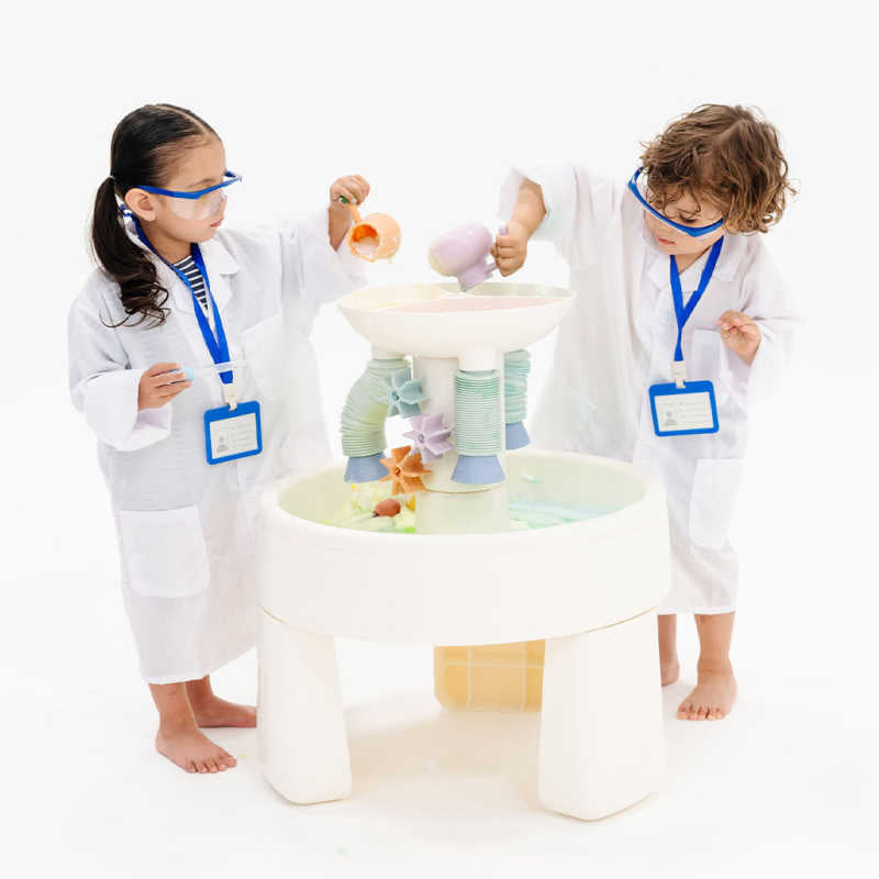 Two kids exploring STEM water play with the Smol Curiosity Water Table