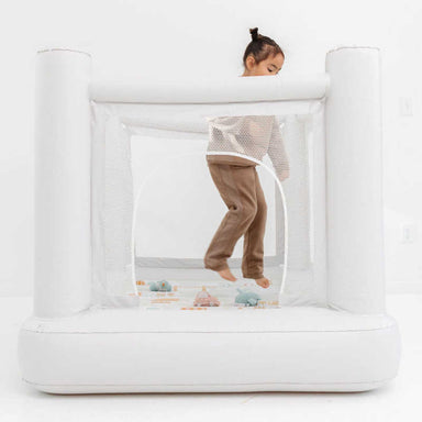 Smol Mini City Indoor Trampoline with a girl jumping inside