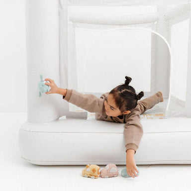 Smol Mini City Indoor Trampoline with girl lying down