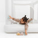 Smol Mini City Indoor Trampoline with girl lying down