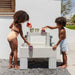 Smol tide water sensory table with 2 kids playing 