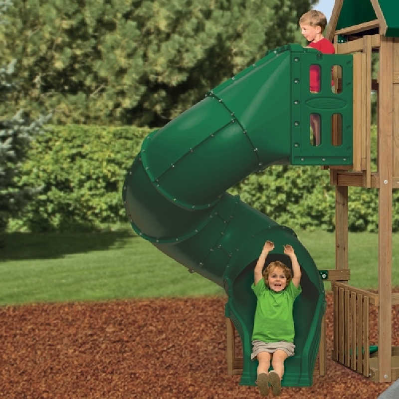 Spiral tube slide in green attached to a playset