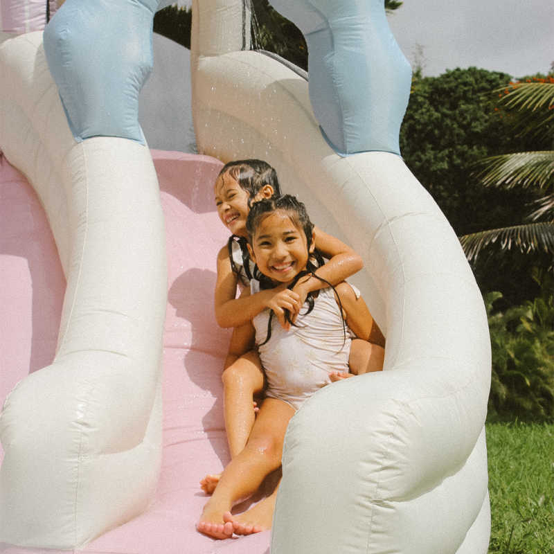 Sunny Splash Water Slide with girls going down the slide