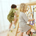 Kids climbing together on the Avenlur Sweetgum XL indoor sensory playset