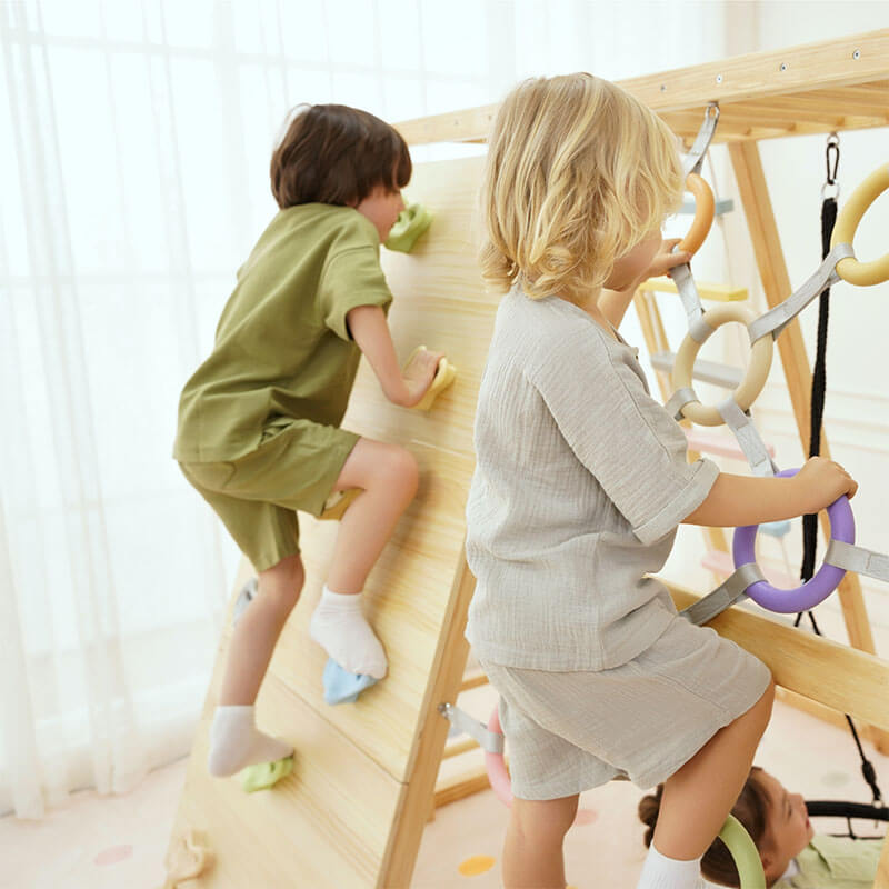 Kids climbing together on the Avenlur Sweetgum XL indoor sensory playset