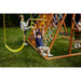 Sycamore Swing Set and Outdoor Climber with boy on trapeeze