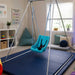 TFH Full Support Swing Seat on a portable swing in a therapy room