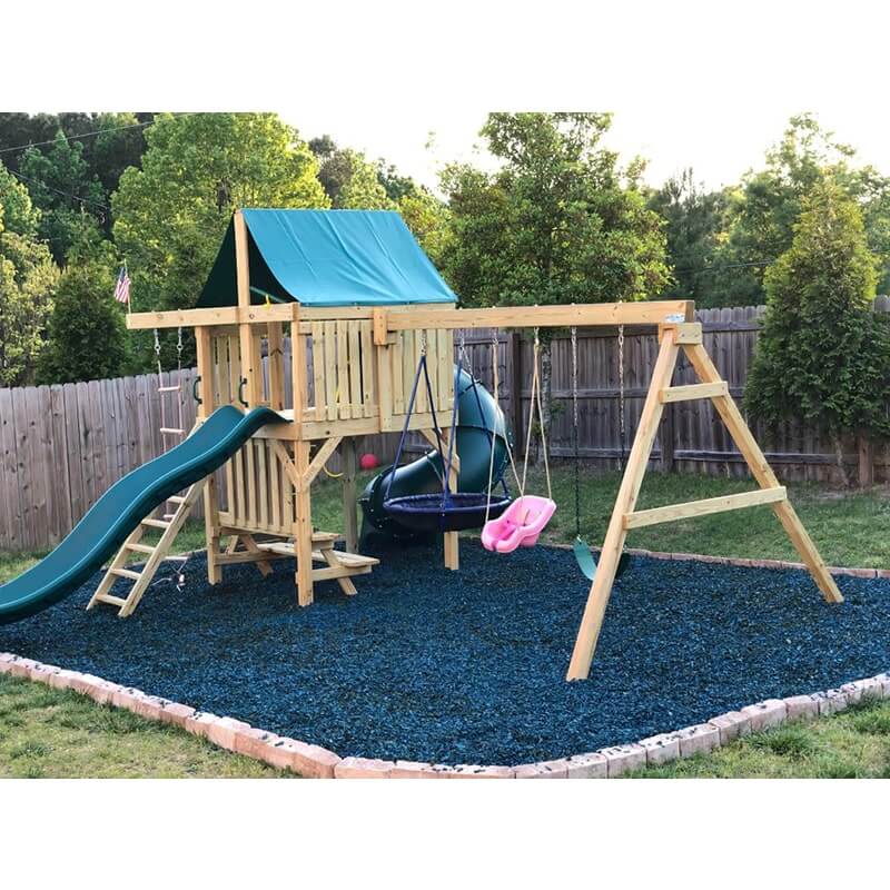 The SwingSet Co. Ultimate Swing Set Lifestyle corner View On A Blue Sand