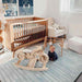 The Bowie Shwally Playmat with a baby in a nursery