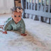 The Josephine Shwally Playmat - Double Sided with a baby crawling 